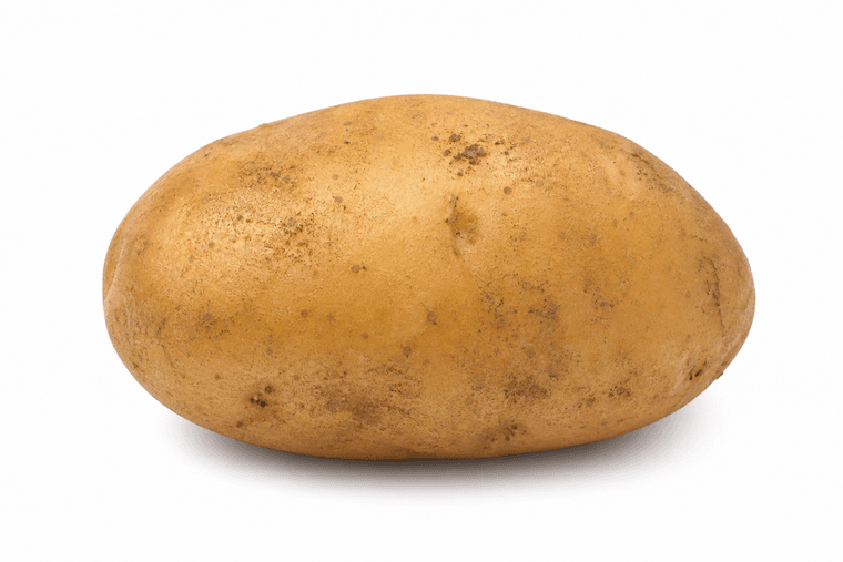 Fresh unwashed potato on a white background